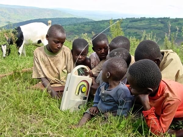 Rwanda focus group with kids, and goats in the background
